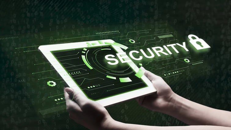 Hands holding a digital tablet displaying the word 'Security' with a padlock icon, representing cybersecurity, data protection, and secure technology.