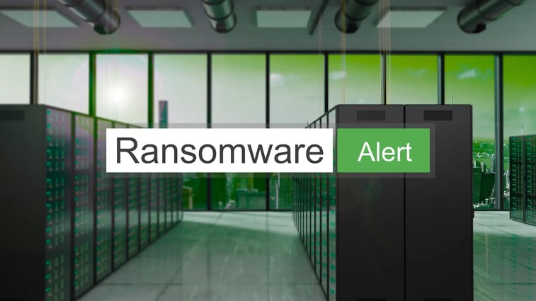 Warning message 'Ransomware Alert' displayed over a server room, representing cybersecurity threats and data protection risks.