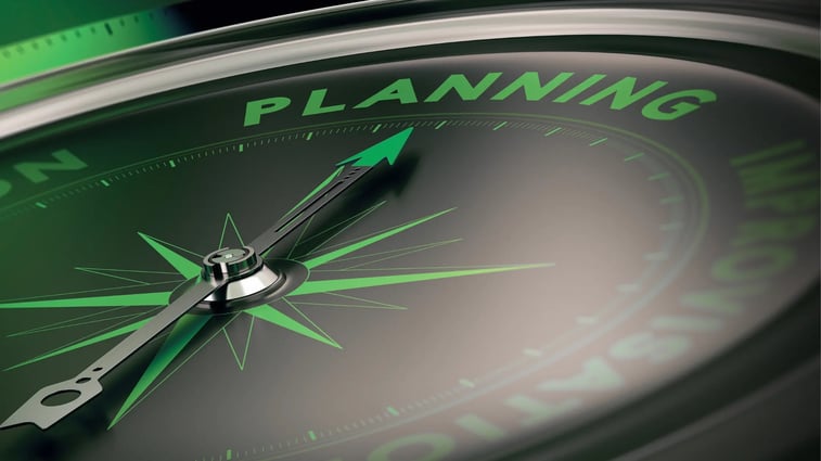 Close-up of a compass with the word 'Planning' highlighted, symbolizing business strategy, goal setting, and direction for success.